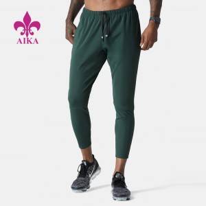 Veleprodajne tovarniške cene, lahke najlonske ozke najlonske jogger hlače z logotipom po meri za moške