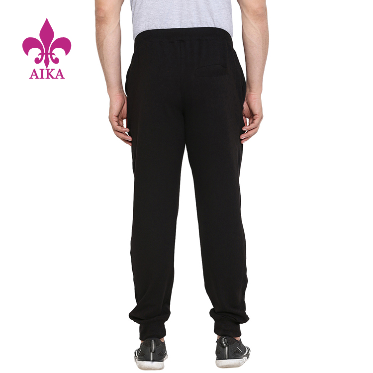 Prilagođene OEM veleprodajne osnovne fitness ležerne muške hlače za trčanje s džepovima