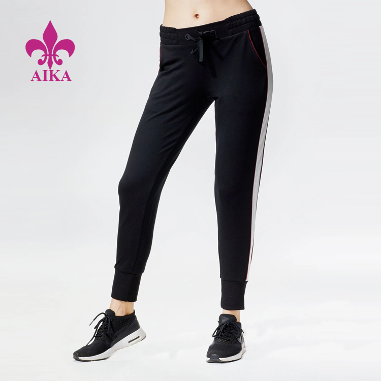 Висококвалитетна прилагођена женска спортска одећа, мекане панталоне за трчање са бочним пругама у француском фротиру