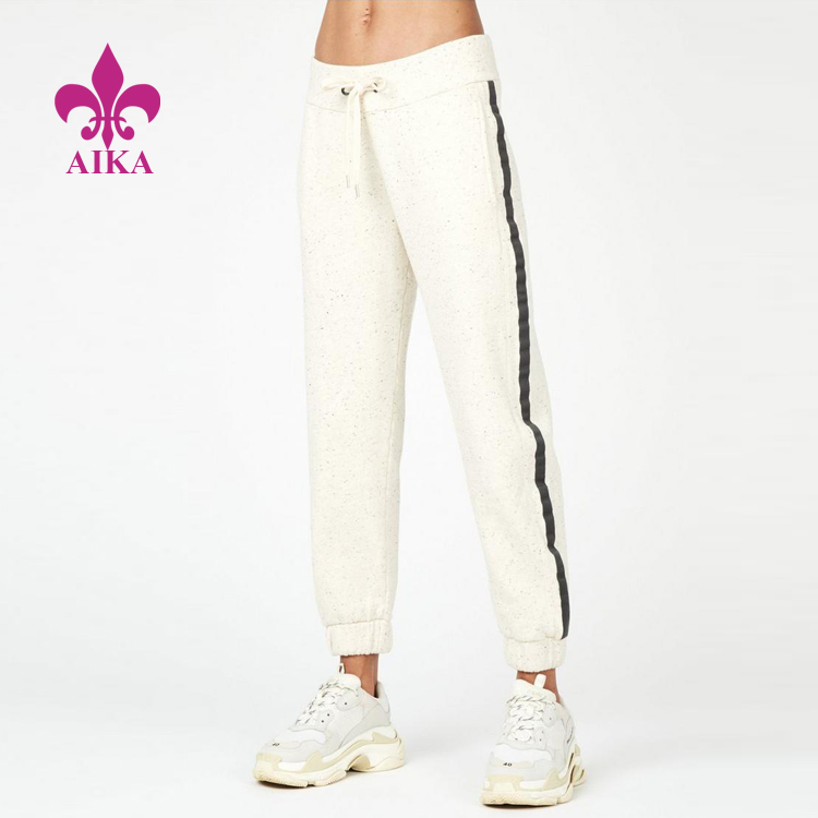 Veľkoobchodné dámske športové oblečenie Útulný dizajn Športové nohavice s pásikom na jogu Joggers Sweat