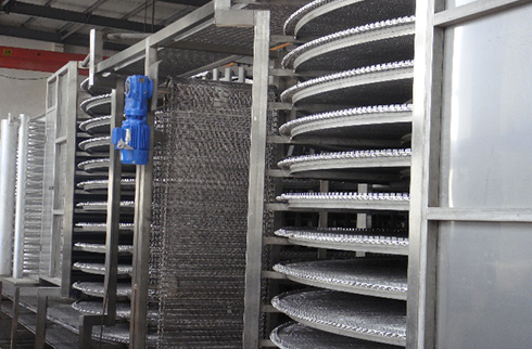 Spiral freezer and conveyor line for seafood freezing in Europe.