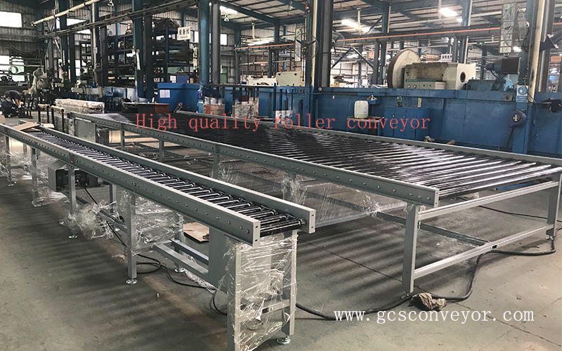 What is a roller conveyor system with a drive chain?