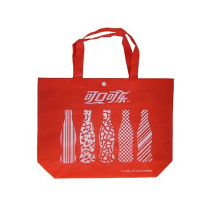 Nonwoven bag with hand