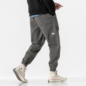 Модні чоловічі брюки з триколірним тривимірним розрізом з кількома кишенями.