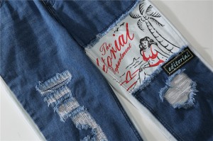 Kualitas tinggi cetak grafiti robek jeans pria jahitan kontras celana denim high street lurus longgar