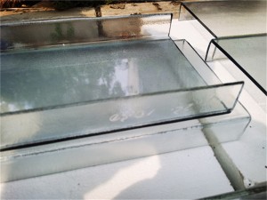 Solar control coated U profile glass