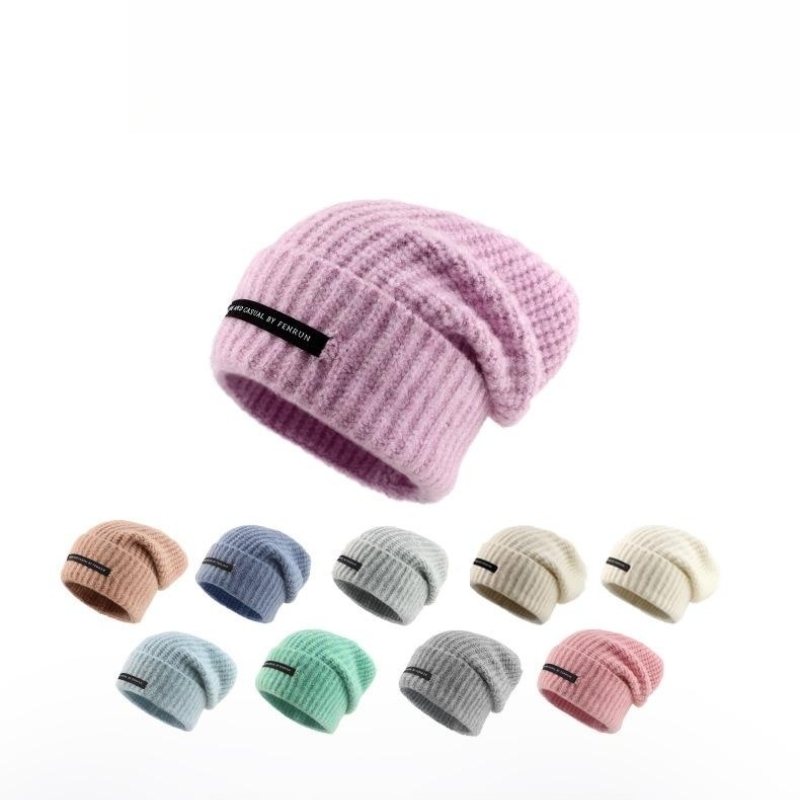 Topi rajutan longgar dengan lilitan jari kaki besar untuk kehangatan dan tumpukan topi