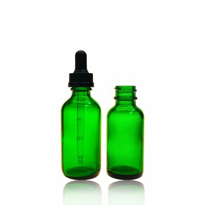 Matná zelená průhledná skleněná láhev s esenciálním olejem