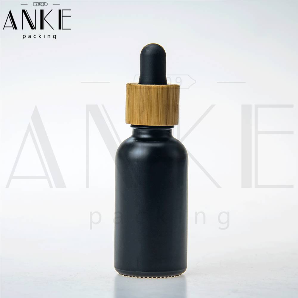 Botella de vidro negro CBD de 30 ml con tapón antimanipulación de cor madeira