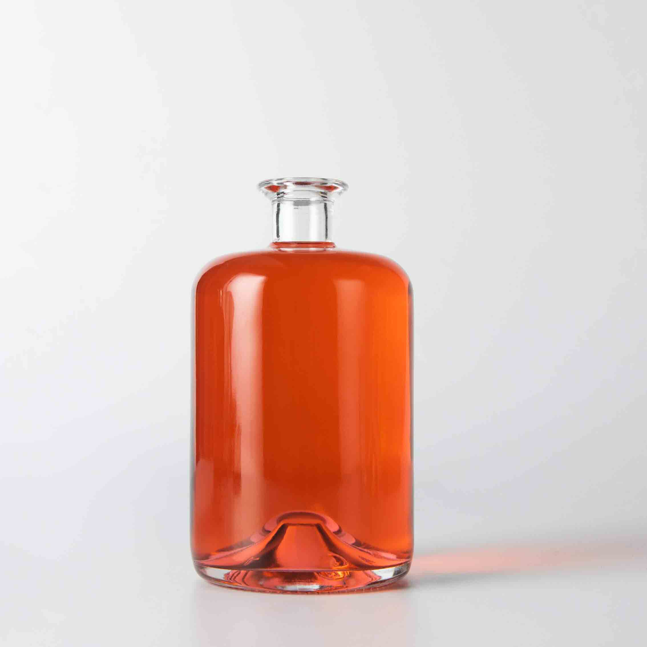 round glass liquor bottle