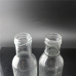 12oz empty chili sauce bottle with black cap and capsule
