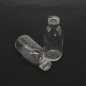 Credible transparent empty glass pharmaceutical bottle/pharmaceutical 100ml white bottle gold cap