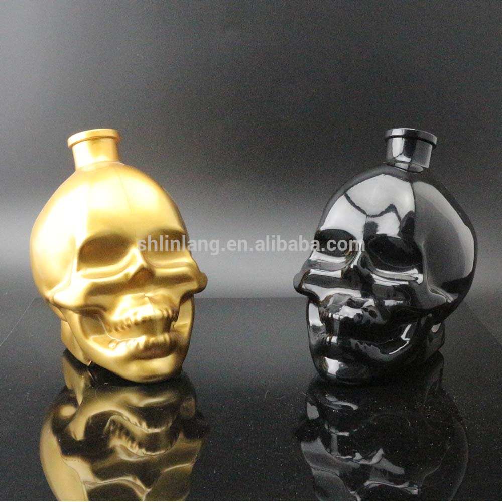 Shanghai Linlang wholesale paint black and gold colors skull head liquor bottle