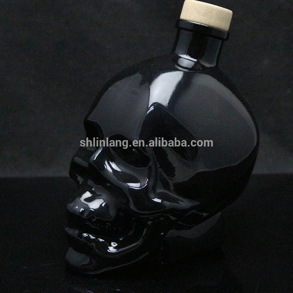 Shanghai linlang High Quality Black Gold Colour Paint Glass Skull Vodka Bottle
