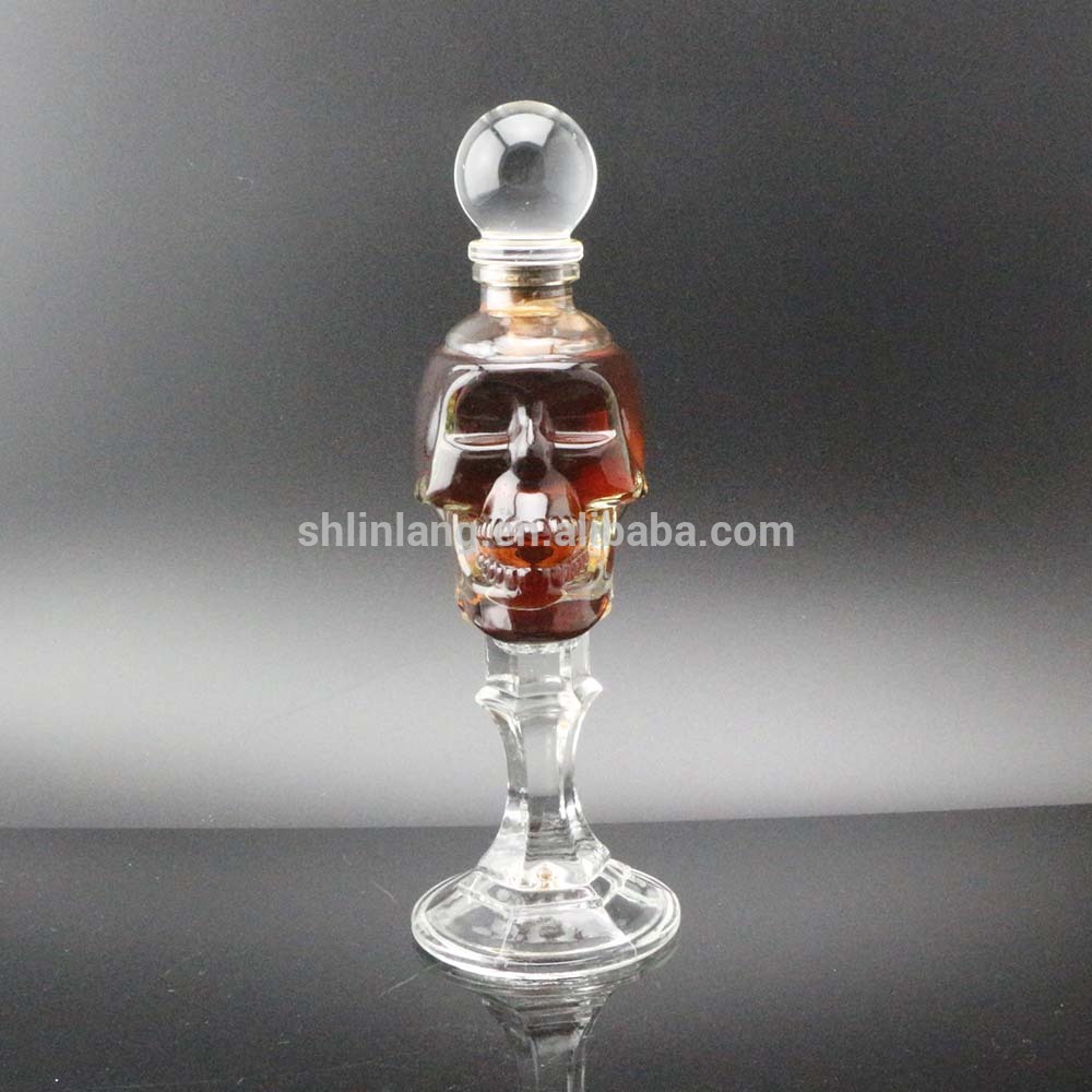 Shanghai Linlang wholesale food safety skull glass vodka alcohol bottle with glass stopper
