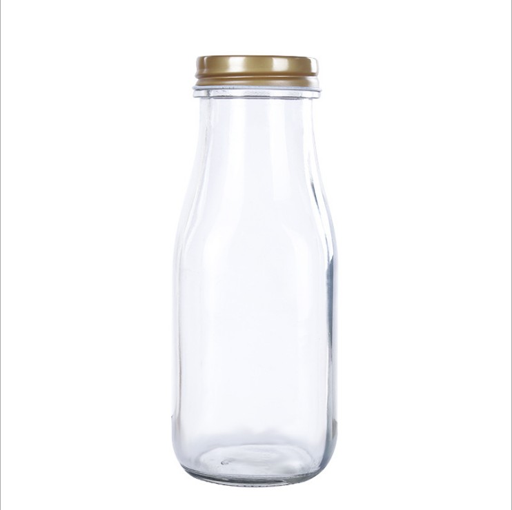 Jualan panas botol Clear Glass botol kaca kosong minuman dengan lug cap Wholesale