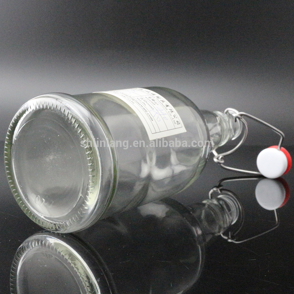 China Supplier Small Glass Essential Oil Roller Ball Bottle - Shanghai Linlang Wholesale Food Grade Glass Bottles With plastic swing top stopper – Linlang