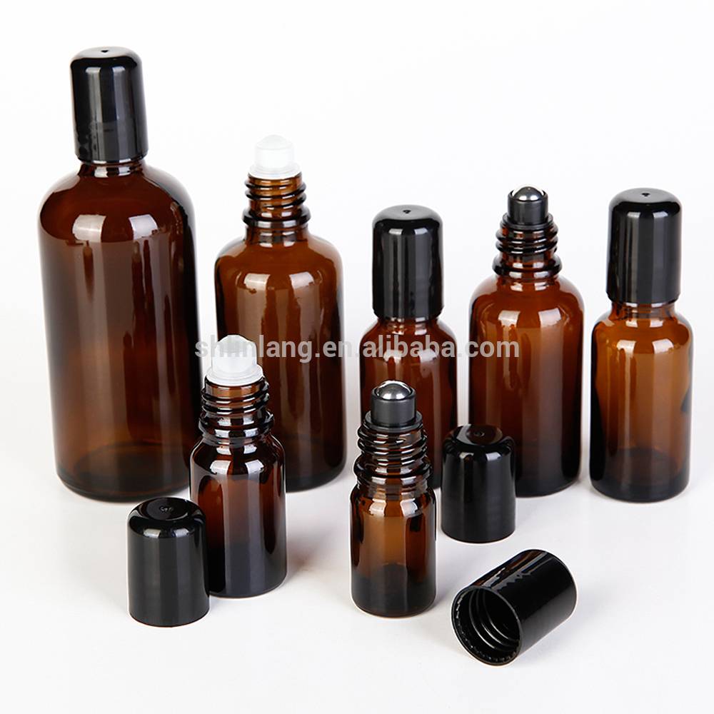 Brown color essential oil glass bottle with metal or plastic roll on ball