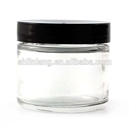 China Suppliers 2oz straight sided clear airtight glass jar with black plastic smooth lids 1oz 2 oz glass jars for lotion