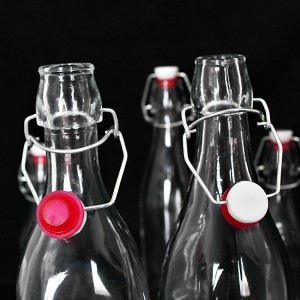 OEM / 250ml Fruit Juice / Flip Top Fino Balancilo Top Beverage Glass Bottle kun Airtight Ĉapo