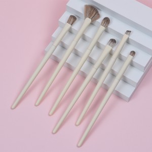DM ທີ່ຂາຍດີທີ່ສຸດປ້າຍຊື່ສ່ວນຕົວສີເຫຼືອງ 10pcs Face / Eye Synthetic Hair Wood Makeup Brush Set ແປງເຄື່ອງສໍາອາງສໍາລັບແມ່ຍິງ