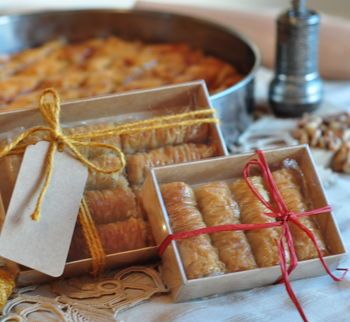 Shrink and stretch packaging processes of of assorted box of baklava