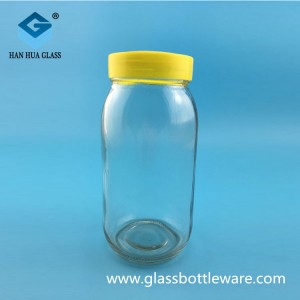 Wholesale price of 700ml round glass honey bottle