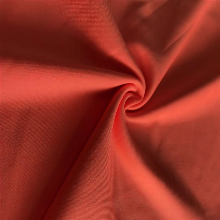 Màu cam rắn 88% Polyester 12% Spandex Vải thun đào tạo Vải Tee