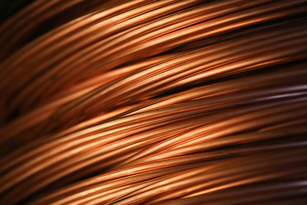 What is the purpose of copper infiltration into a PM component, and how is it accomplished?