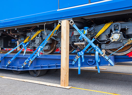 What safety steps should you take before transporting a load?