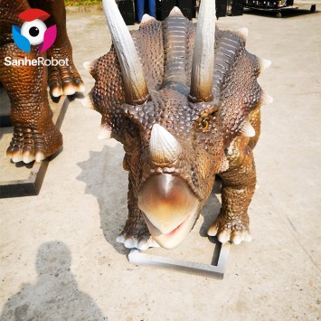 Mother and son triceratops dinosaur appear at a dinosaur theme park