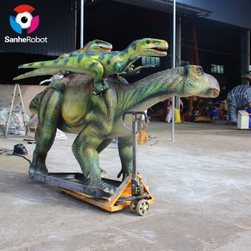 life-sized animatronic dinosaur deinonychus attacks iguanodon model