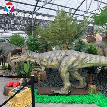 Scene dinosaur-Dilophosaurus eat meat in the theme indoor park