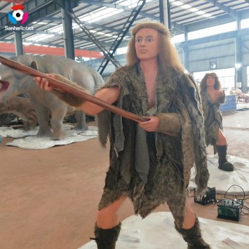 Életnagyságú, valósághű vadászó primitív férfi szobor a vidámparkba