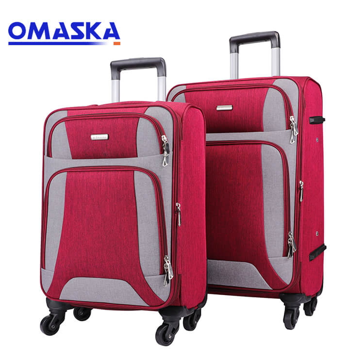 Vroča prodaja tovarniške ročne prtljage za potovanja - trpežne torbe po meri s 4 kolesi, nepremočljiva mehka potovalna prtljaga iz rdečega najlona – Omaska