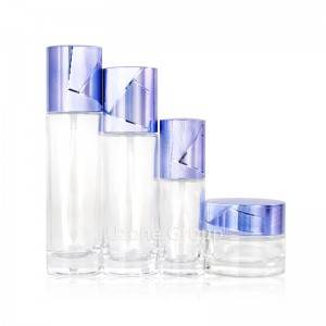 High end cylinder skin care glass packaging set with metallic blue lid
