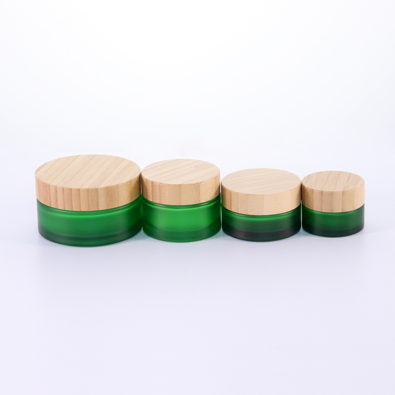 Factory supplied Empty Cosmetic Jars Wholesale - Hot sale Cosmetic Glass Jar Frosted Green 50g 100g Glass Cream Jar with Bamboo Lids – Uzone