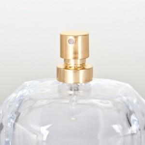 New perfume bottle with golden sprayer and thick bottom