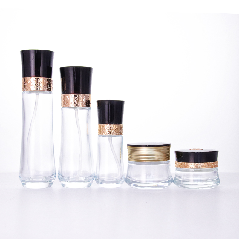 Glass Bottle Suppliers Europe - Wholesale luxury transparent glass bottle and jar with beautifully carved black cap for skincare packaging set – Uzone