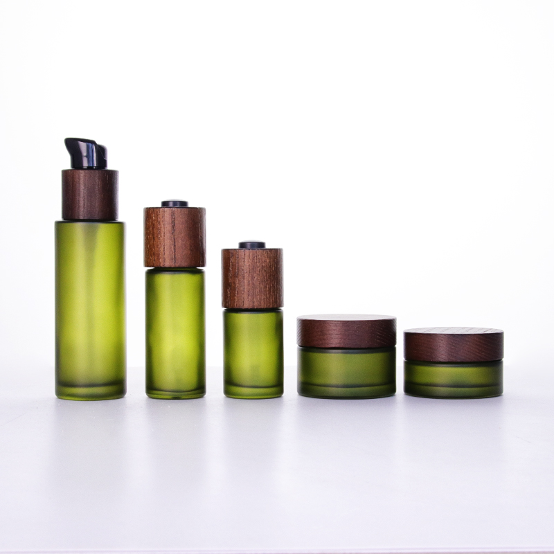 Unique Jars With Lids - 30ml 50ml 100ml high quality luxury green colored lotion bottles with wooden dropper and 30g 50g cream jar with wooden lid – Uzone