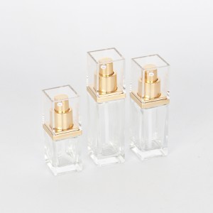 Clear square glass bottles with golden lotion pump and cover