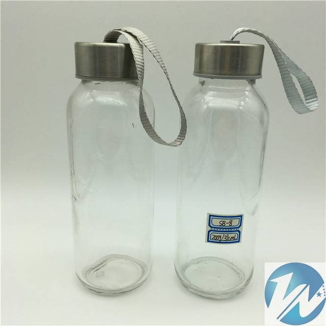 Cylindrical glass water bottle with silicone cover and cup sleeve