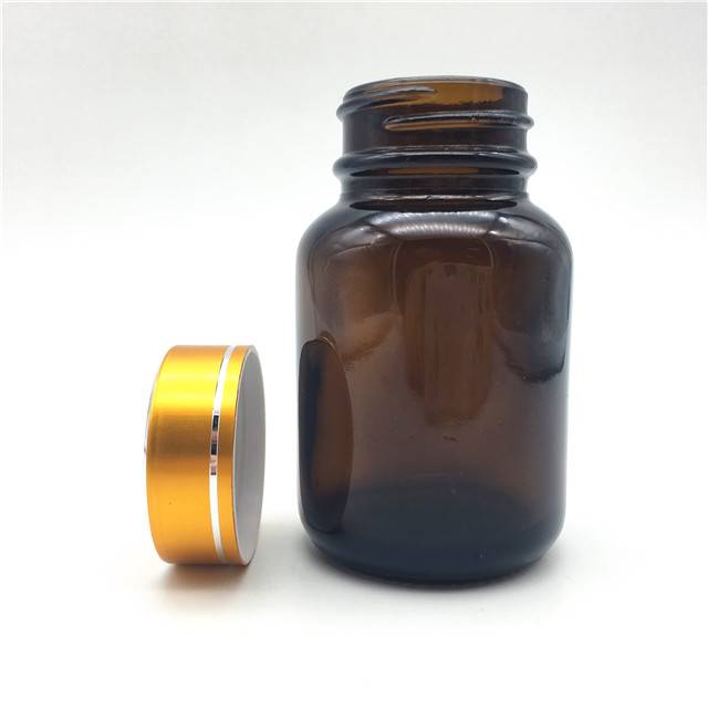 Capsule Glass bottle with plastic golden lid