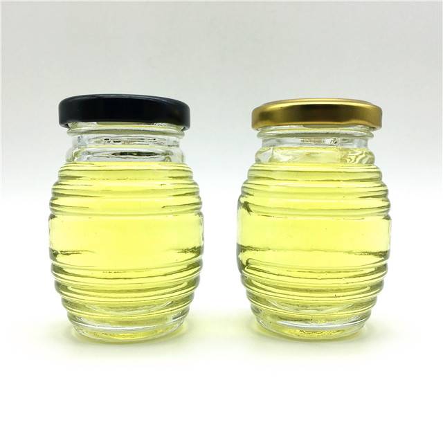 beautiful and hot sale 100ml Beehive shape spiral stripes honey glass jar with tin lid