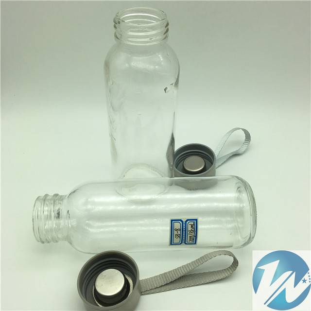 Cylindrical glass water bottle with silicone cover and cup sleeve