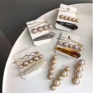 Mga clip sa buhok nga perlas