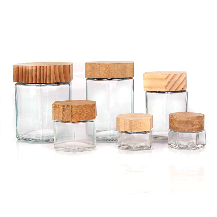 Benutzerdefinierte 70 ml 180 ml 280 ml 380 ml Weithals-Honigglas in Lebensmittelqualität, sechseckiges Glas mit Holzdeckel