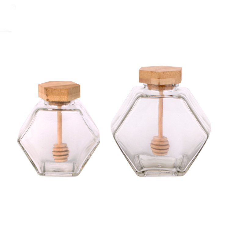 China Supplier hexagon honey glass jar with wood cap and honey dipper Featured Image
