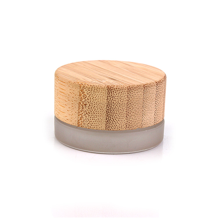 glass cosmetic jar with bamboo lid