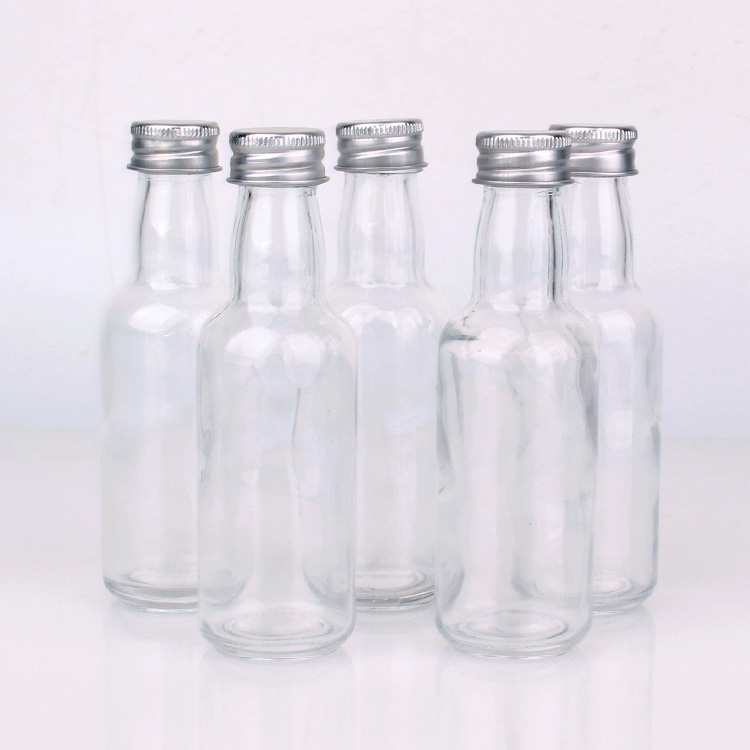 bouteille en verre de vin rond de 50 ml avec couvercle en aluminium argenté Photo descriptive